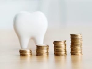 Stacks of coins symbolizing dental practice revenue