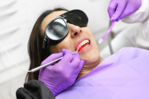 a patient receiving dental care with a diode laser
